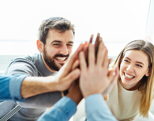 businessman businesswoman success young business team high five support unity celebrating give me...