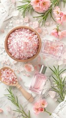 Naklejka premium A calming spa setup with bowls of pink Himalayan salt, essential oil bottle, delicate flowers, and a soothing candle arranged on a light grey surface