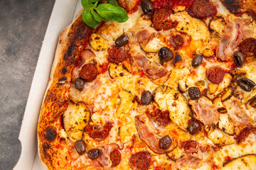 pizza chicken meat, sausages, olives, cheese, tomato sauce.fresh meal food snack on the table copy space food background rustic top view