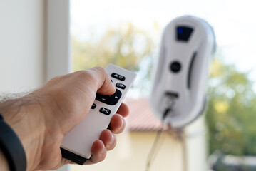 Remote control of a robotic window washer that washes glass from dirt and stains.