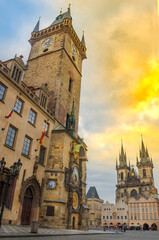 Naklejka premium Beautiful Old Town Square with Church of our Lady Tyn and medieval astronomical clock on the Old Town Hall Tower, in Prague, Czech Republic, at sunrise