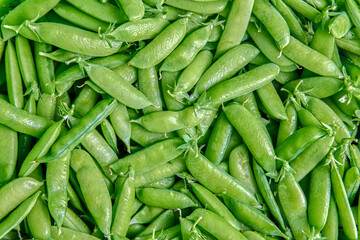 Garden peas are also sometimes called sweet peas or English peas, plant texture for background or...
