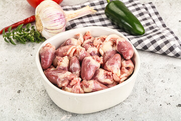 Fresh raw chicken hearts in the bowl