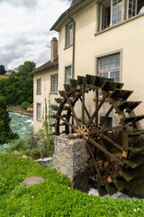 Old mill water wheel at the Neuhausen Rhine Falls - Switzerland Europe