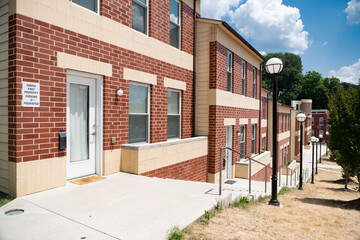 New modern condominium house in the city. Facade of new modern residential. Brick finishing of the facade.