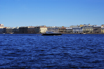Obraz premium A pleasure boat floating on the river, river canals, tourist walks, Vacation.