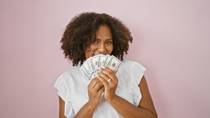 African american woman smiling with us dollars