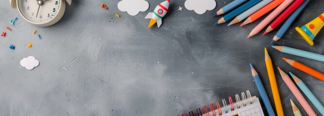 Colorful Art Supplies and Clock on Gray Background for Creative Projects