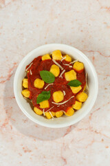 Gnocchi with tomato sauce, basil, cheese. italian dish, homemade food, pasta.