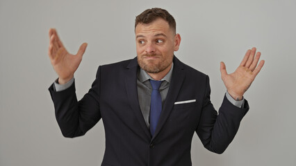Confused businessman shrugging in suit isolated on white background