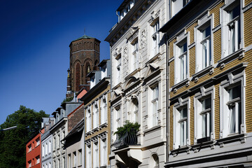 carefully restored pastel-colored old buildings in the cologne district of Lindenthal with the...