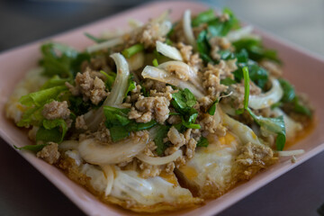 Traditional Pad Kra Pao Moo, pork recipe spiced with basil, in Isan, eastern Thailand, Udon Thani Province, Laab Moo