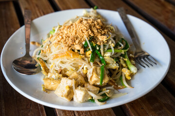 Pad Lao: Delicious Noodles Dish Topped with Tofu and Crunchy Peanuts, Authentic Flavors of Lao Cuisine and Northern Thailand – A Glimpse into Southeast Asian Delights