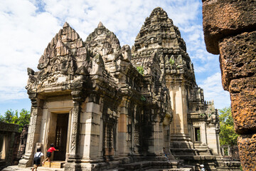 Naklejka premium Ruins of Prasat Phimai (Phimai Historical Park) in eastern Thailand, a popular tourist destination in Isan region, Nakhon Ratchasima province, two children in the foreground