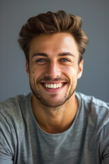 Fototapeta premium Portrait of a smiling joyful handsome man. High quality photo