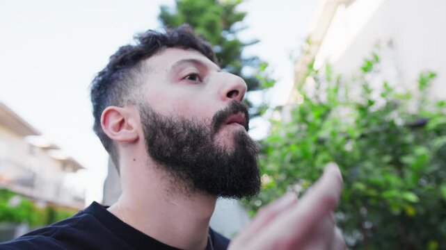 Boy Eats Healthy Peanuts Outdoor In The Park