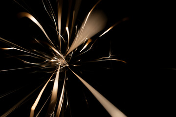 sparks from the grinder glowing in the dark
