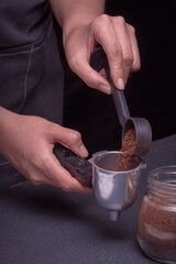 Woman Barista operates a machine to prepare delicious coffee