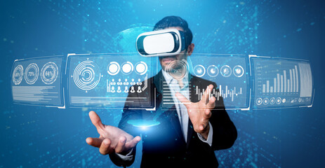 Skilled business man looking data analysis while planning strategy by using visual reality glasses....