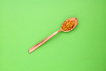 Trigonella foenum-graecum - Natural aromatic fenugreek seeds in the spoon