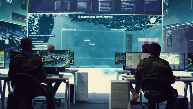 Group of soldiers managing air and sea traffic control for military operations success, working together in federal command post. National surveillance systems using satellite radar. Camera B.