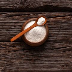 Baking soda - Crystalline solid compound in spoon and bowl.