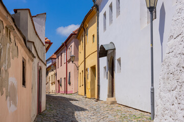 Fototapeta premium Old stone street and colorful houses