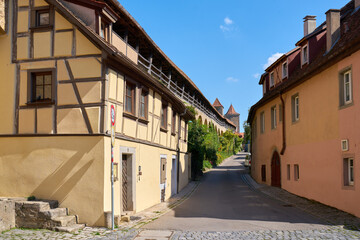 Rothenburg ob der Tauber Narrow Street. A narrow street in the heritage city of Rothenburg ob der Tauber, Germany.

