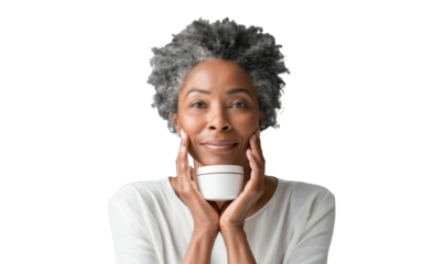 Portrait of a smiling senior African American woman holding a jar of of cosmetic skincare cream, concept of beauty, isolated on transparent background