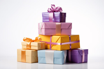 A stack of colorful gift boxes with satin ribbons, perfect for a birthday or special occasion.