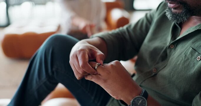 Divorce, hands and man with wedding ring on a sofa frustrated by jealous, liar or screaming woman at home. Marriage, fail or angry people in living room with argue stress, dispute or shouting partner