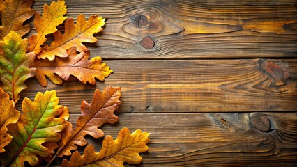 Obraz premium Oak leaves on a rustic wooden background, oak leaves, wooden background, nature, autumn, texture, organic, natural, rustic