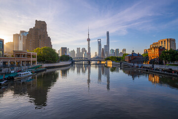 Naklejka premium view of shanghai skyline and bridge at sunrise