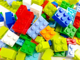 Various colored toy blocks on a white background. Educational toys for children