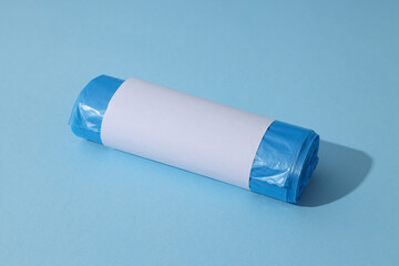 Roll of garbage bag on blue background