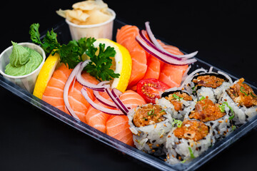 6 pieces of Spicy Salmon roll, 4 pieces of Salmon sushi, and 3 pieces of Salmon sashimi