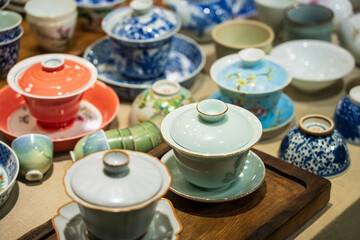 Beautiful Array of Colorful Ceramics: Traditional Tea Sets and Bowls