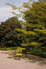 green patio furniture in the park