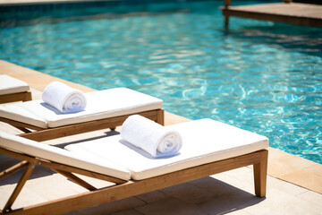 Invitation to Relax White Towels Await at the Poolside