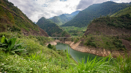 Mountain landscape with river and bridge in North Vietnam