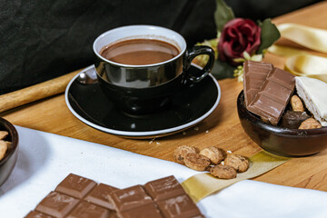 Chocolate chip cookies, dark and white chocolate bar, small bowl of oatmeal and nuts. International Chocolate Day.
