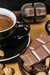 Chocolate chip cookies, dark and white chocolate bar, small bowl of oatmeal and nuts. International Chocolate Day.