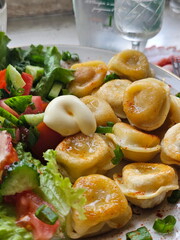 Fried dumplings on a checkered tablecloth