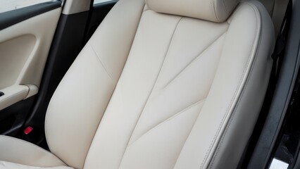  the back seats on a modern car with black trims,