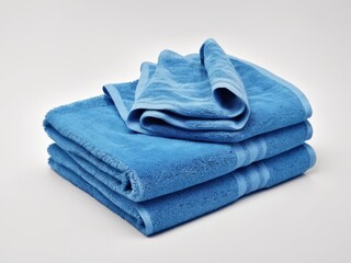 neatly folded sapphire blue towel isolated on white background.
