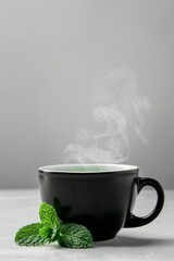 Mint herbal tea in a steaming cup, isolated background, ample copy text space, minimalist and relaxing composition
