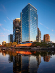 Fototapeta premium Modern City Skyline and Water Reflections at Dusk