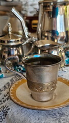 Ceramic coffee cup on table with white tablecloth