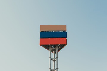 Urban colorful modern structure billboard with blue sky background