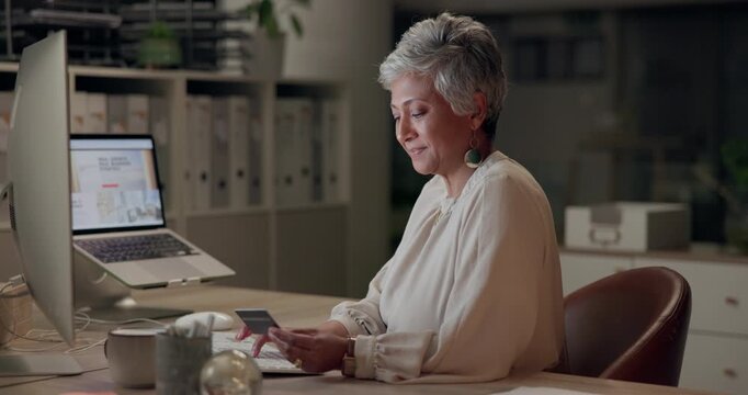 Business, woman and typing with credit card at night for online, digital asset purchase and service payment. Mature, graphic designer and internet for website hosting fees and software subscription.